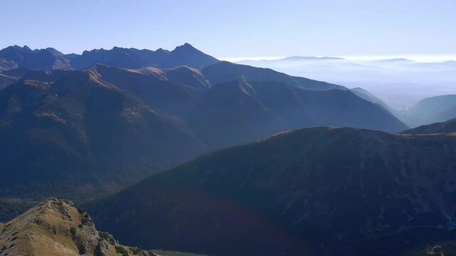 Flying around the rounded peak of Ciemniak, with a far-reaching views over the Tatra Mountains in Autumn.