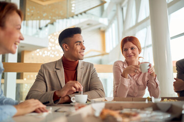 office workers eating and discussion.