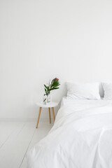 Naklejka premium Bedroom in white apartment with modern interior design