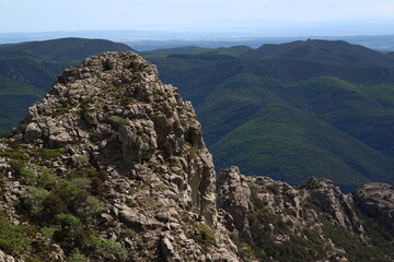 Fototapeta premium Panoramic view of the south of the Hérault department from the Caroux plateau, near the Gorges de Colombières (Hérault, Haut Languedoc, France).