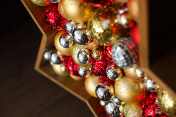 Christmas decoration - red silver golden balls in star form. Defocused