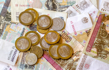 Coins and Russian banknotes lying on the table