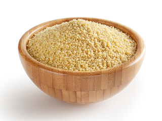 Uncooked dried cous cous in wooden bowl isolated on white background with clipping path