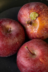 Close up of three red apples. Dark mood food photography