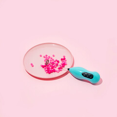 Holidays idea of Christmas decorations in a plate for eating. Festive minimal composition on pink backgrounds. Trendy concept.