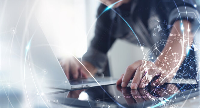 Internet network technology, digital software development, future tech background, IoT concept. Man using digital tablet and laptop computer with global network connection