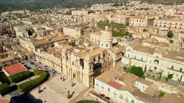 Aerial view of Cathedral of Noto (La Chiesa Madre di San Nicol&ograve;), UNESCO world heritage site and example of sicilian baroque. Drone flies above the Cathedral of Noto in the central street
