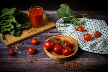 Tomato juice with cherry tomatoes. tomato juice with tomatoes on a dark background