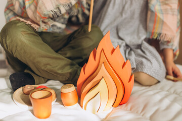 Children playing with Eco friendly, plastic free toys. Stylish wooden toy for kids Modern wooden colorful toys. Space for text