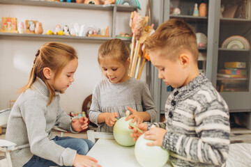 Fototapeta premium Happy smiling children playing together with wooden eco toys. Friendship,children activity