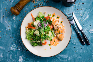 fresh salad of vegetables and chicken breast