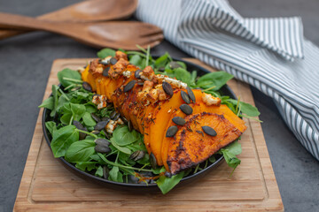 baked hasselbeck butternut pumpkin with feta cheese and fresh herbs