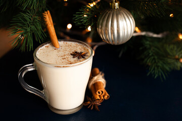 Obraz na płótnie Canvas homemade traditional Christmas drink eggnog with spices and cinnamon. Winter holidays.