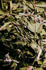 Heap of loose leaf herbal tea leaves, tea texture