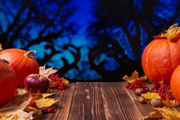Naklejka na ściany i meble Pumpkins and autumn fruits, vegetables and berries on wooden background.