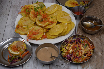 Vegan wheat starch pancakes with side salad and sauces