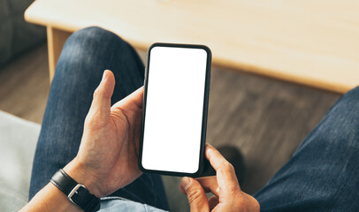 cell phone blank white screen mockup.hand holding texting using mobile on desk at office.background empty space for advertise.work people contact marketing business,technology
