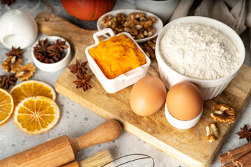 Ingredients for American pumpkin pie, blondie or bars on a light culinary background. Products for homemade traditional autumn baking close-up