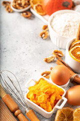 Ingredients for American pumpkin pie, blondie or bars on a light culinary background. Products for homemade traditional autumn baking close-up