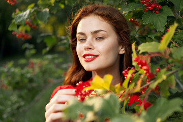 Naklejka premium Beautiful woman fresh air summer berries nature