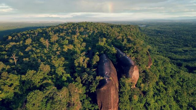Aerial view point of interest over Exotic landscape with the rainbow in the morning sky at Three Whale Rocks (Hin Sam Wan) a famous tourist attraction of Bueng Kan province amazing Thailand