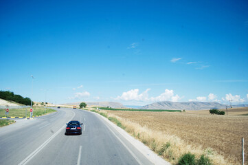 GREECE: Scenic landscape view with the road and mountains in the background 