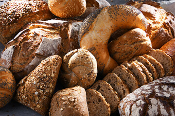 Assorted bakery products including loafs of bread and rolls
