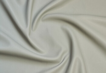 beige artificial leather with waves and folds on PVC base
