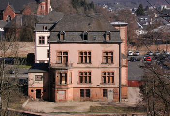 Lost place: an abandoned historical villa facade with oriel windows in the suburb of Trier Ehrang,...