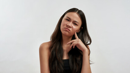 Fototapeta premium Portrait of unhappy Asian woman feel lazy and bored