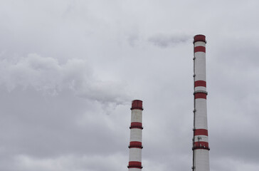 Smoke is emitted from the production chimneys, polluting the air.