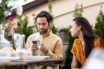 Family and friends celebrating at dinner on a rooftop terrace
