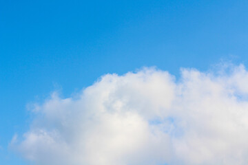 Blue peaceful Sky with fluffy clouds wallpaper. Idea for backdrop design