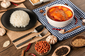 Chicken Massaman Curry on white bowl. Muslim curry or mussaman curry.  Muslim style chicken and potato or chicken mussaman curry.