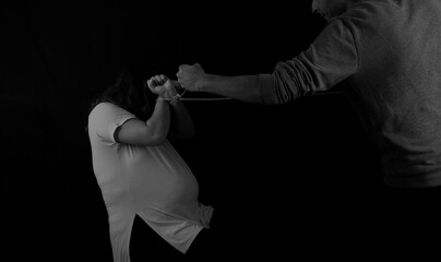 black and white photo of man who abuses pregnant woman