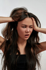 Fototapeta premium Narrow shot of Asian woman feel displeased