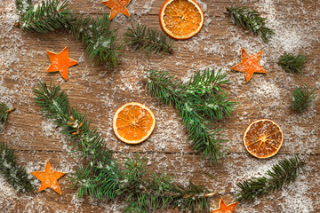 Waste-free Christmas background. christmas frame with fir branches, dried fruits and dried oranges....