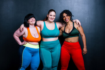 Curvy women posing in studio for a body positive photosession