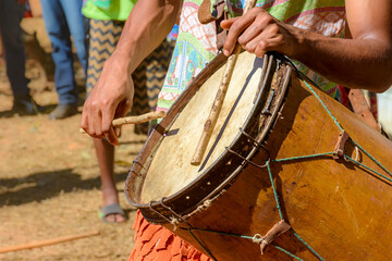 Fototapeta na wymiar Ethnic and rustic handmade drums in a religious festival that originated in the mixing of the culture of enslaved Africans with European colonizers