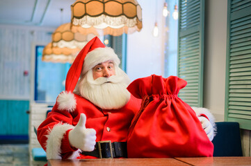 Friendly santa claus in a cafe.