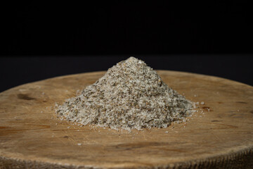 Salt mixed with spices on a black background. Traditional seasoning.