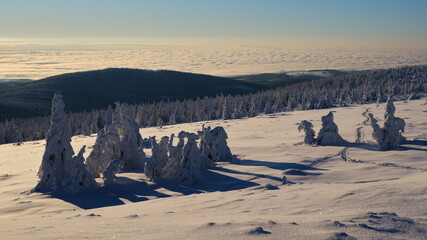 Mountain ridge in winter with a view to the lowlands.