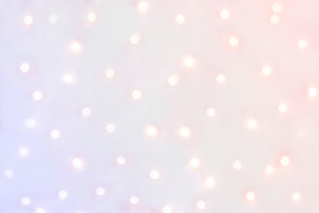 Bright defocused lights on a purple background. Abstract background