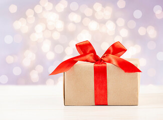 gift box on the table against the background of defocused lights