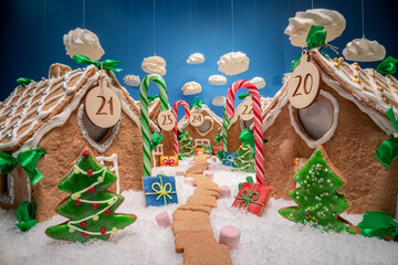 Gingerbread village for Christmas. Gingerbread cottage with meringue clouds.