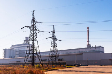 Electric pole and electric cable on the field. Power pylons and high voltage lines in an agricultural landscape.lines, power transmission lines