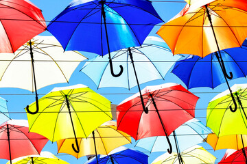 Avenue of color umbrellas. a lot of different umbrellas. Summer mood. Concept Good mood, positive.