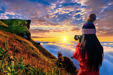 Tourist taking photographs with digital camera in a mountains. Phu chi fa mountains in Chiang Rai,...