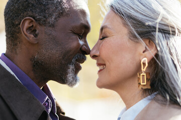 Storytelling image of a multiethnic senior couple in love