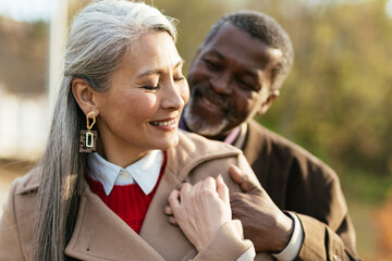 Storytelling image of a multiethnic senior couple in love